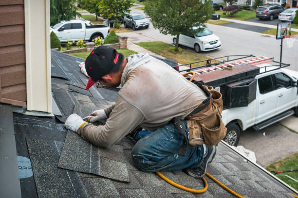 Professional Gutter Repair And Installation technician working in Elmhurst, NY